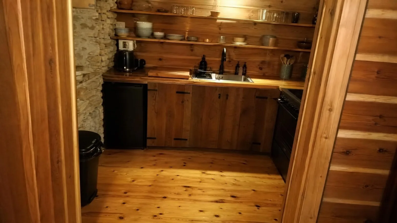 Source photo of a log-cabin living room, 1 of 3, taken on a phone