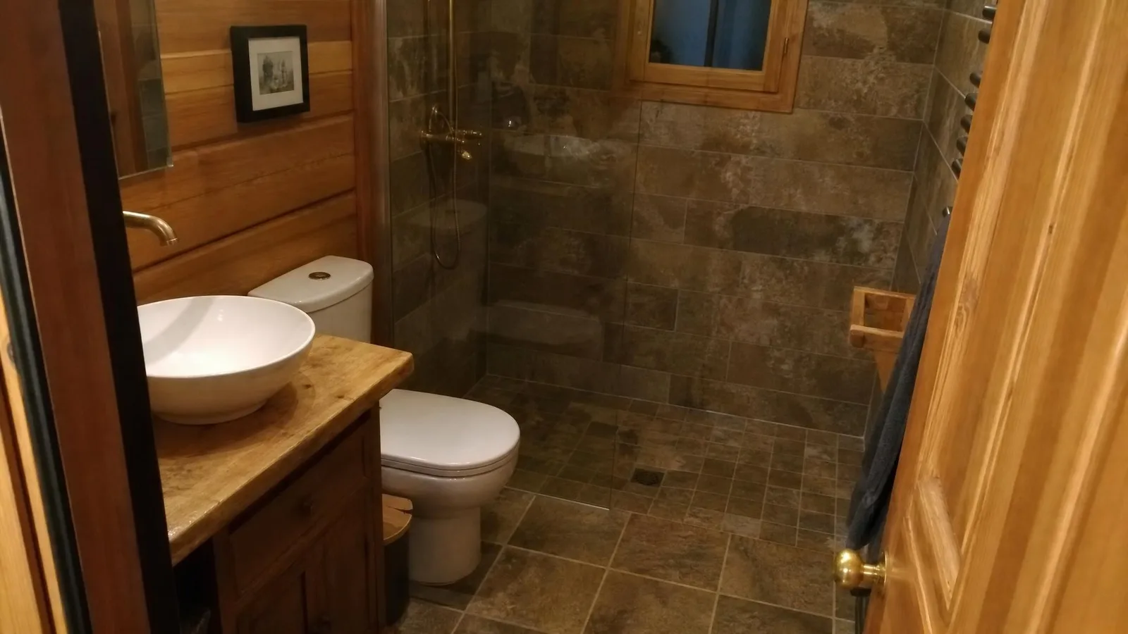 Source photo of a log-cabin living room, 2 of 3, taken on a phone