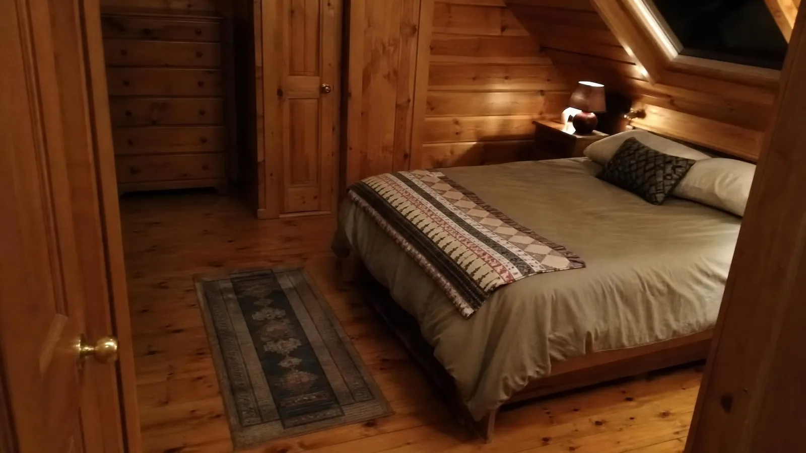 Source photo of a log-cabin living room, 3 of 3, taken on a phone