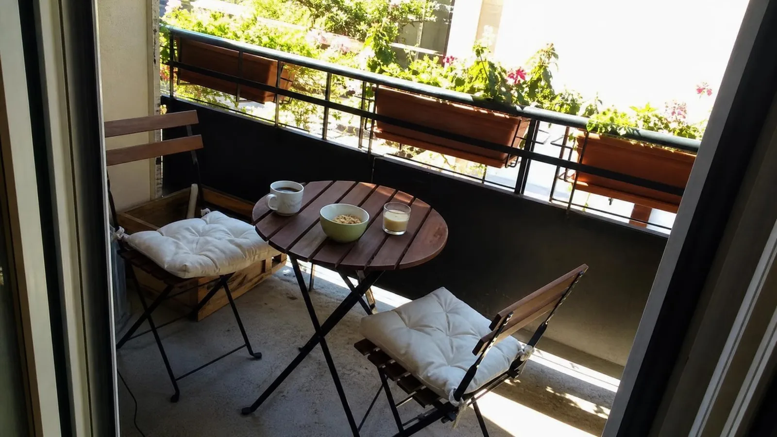 Source photo of a courtyard dining terrace, 3 of 3, taken on a phone