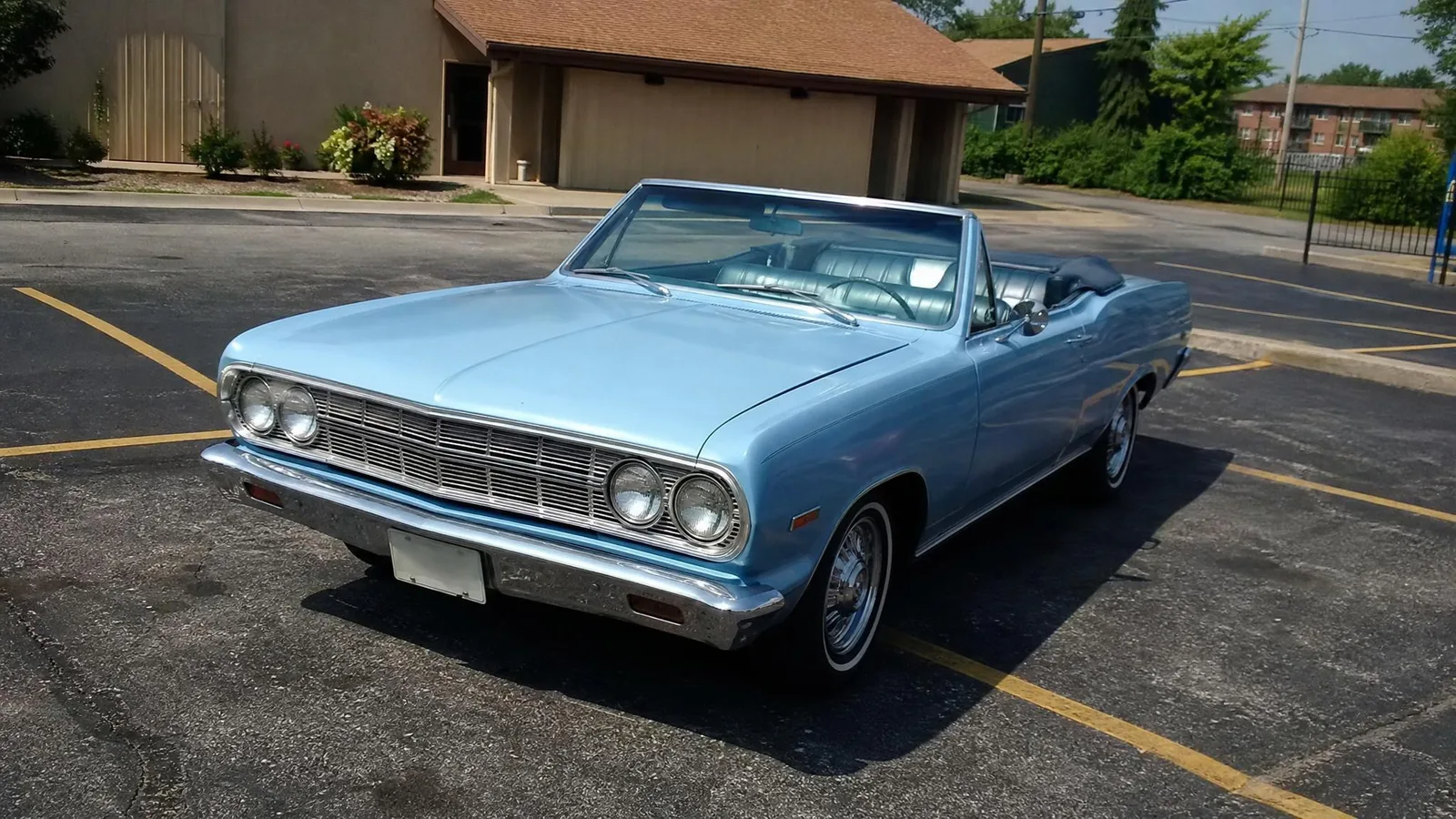 Source photo of a light blue classic convertible, 1 of 2, taken on a phone