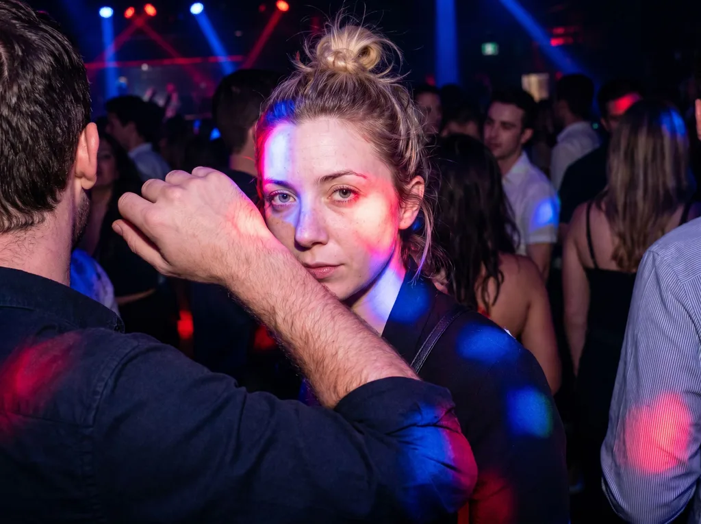 Source photo of a blonde woman with her hair in a bun, 2 of 3, taken on a phone