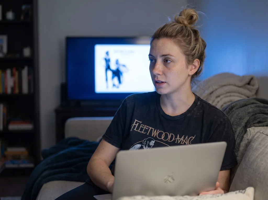 Source photo of a blonde woman with her hair in a bun, 3 of 3, taken on a phone