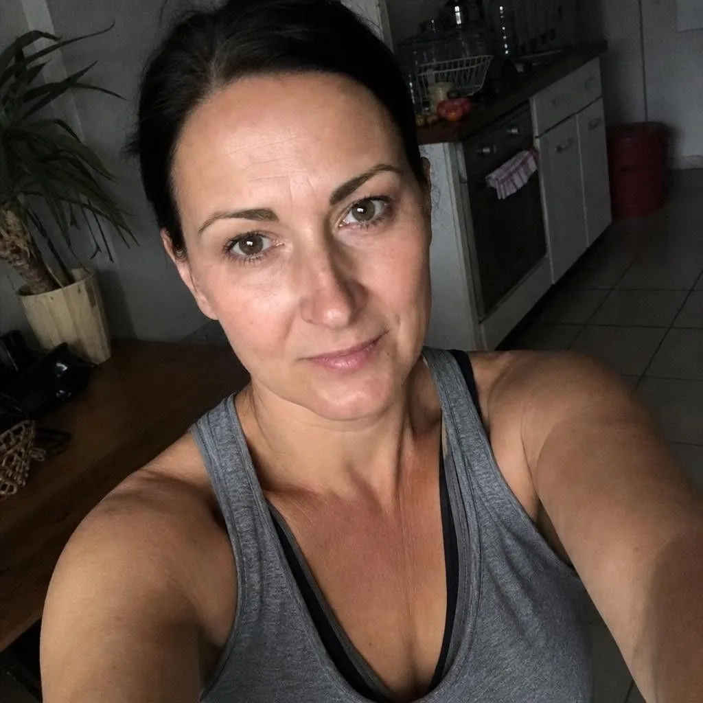 Source photo of a dark-haired woman in her forties, 1 of 2, taken on a phone