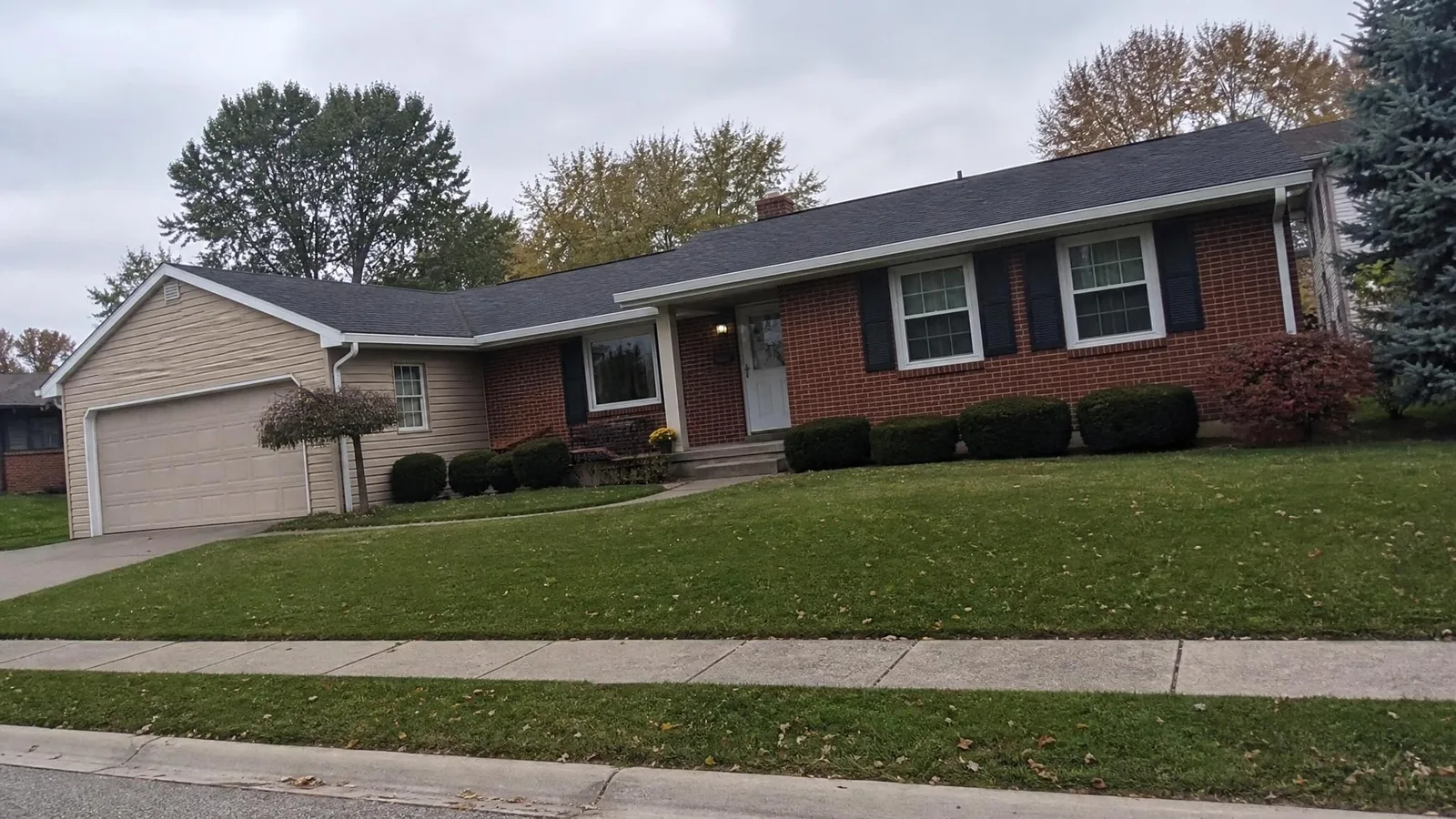 Source photo of a brick ranch house, 1 of 1, taken on a phone