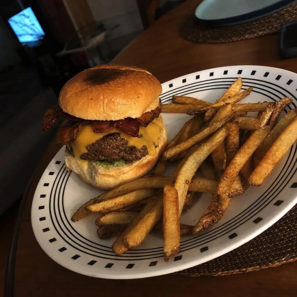 Source photo of a bacon cheeseburger with fries, 1 of 1, taken on a phone