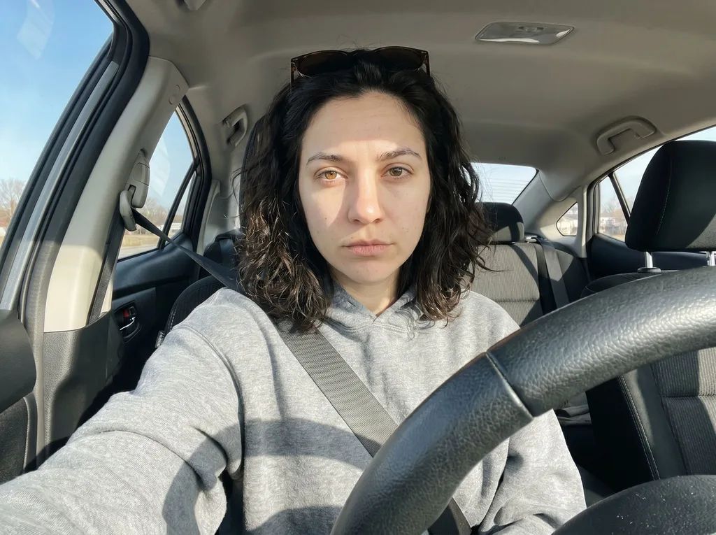 Source photo of a woman with dark curly hair, 3 of 3, taken on a phone