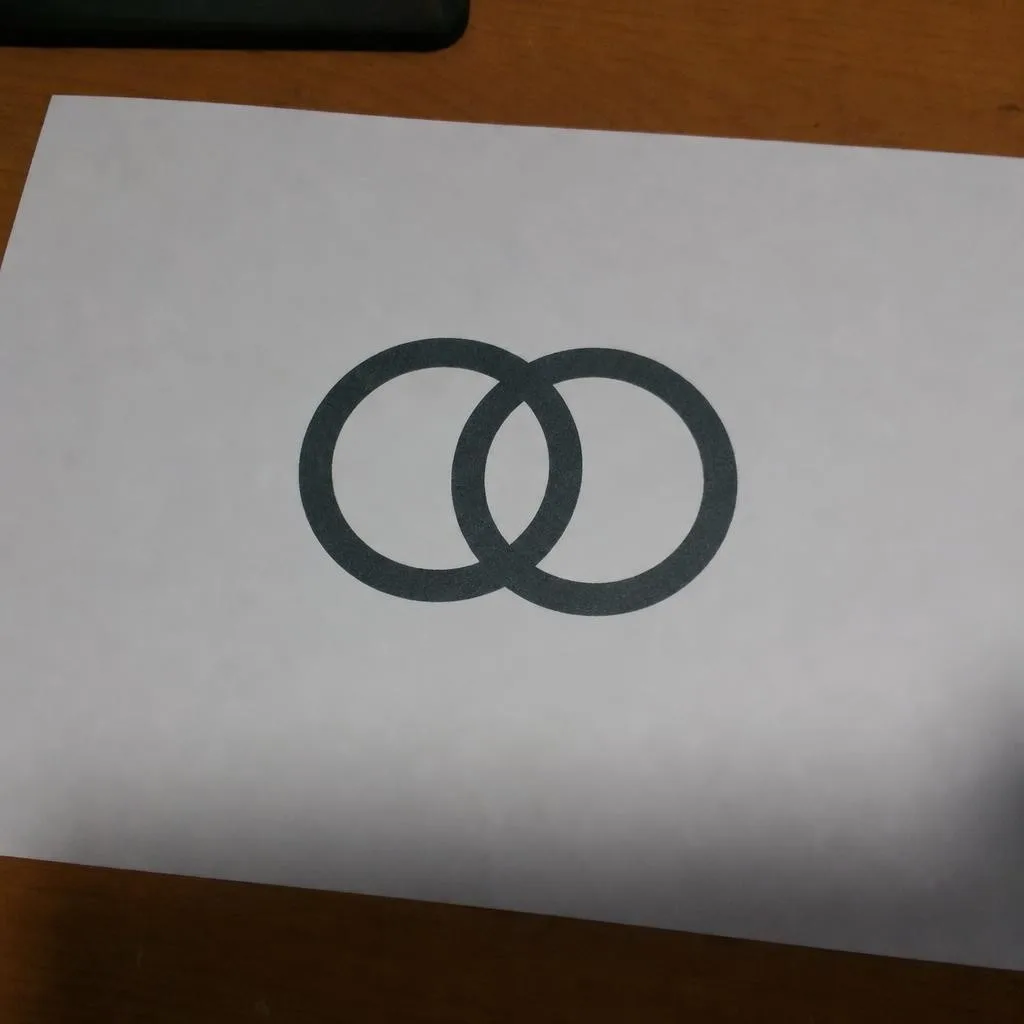 Source photo of a circles logo on a storefront door, 1 of 1, taken on a phone