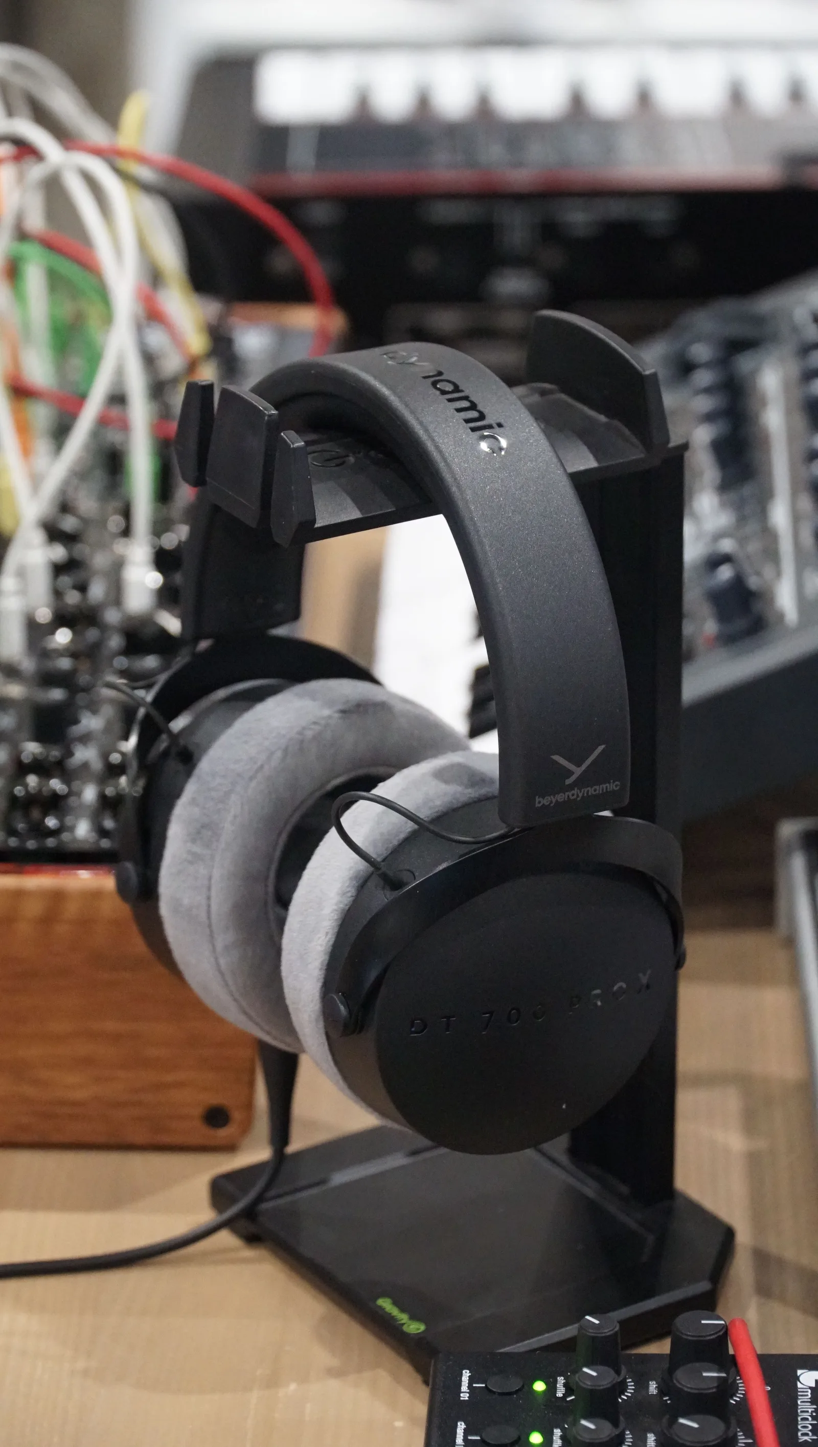 Source photo of black over-ear headphones, 1 of 3, taken on a phone