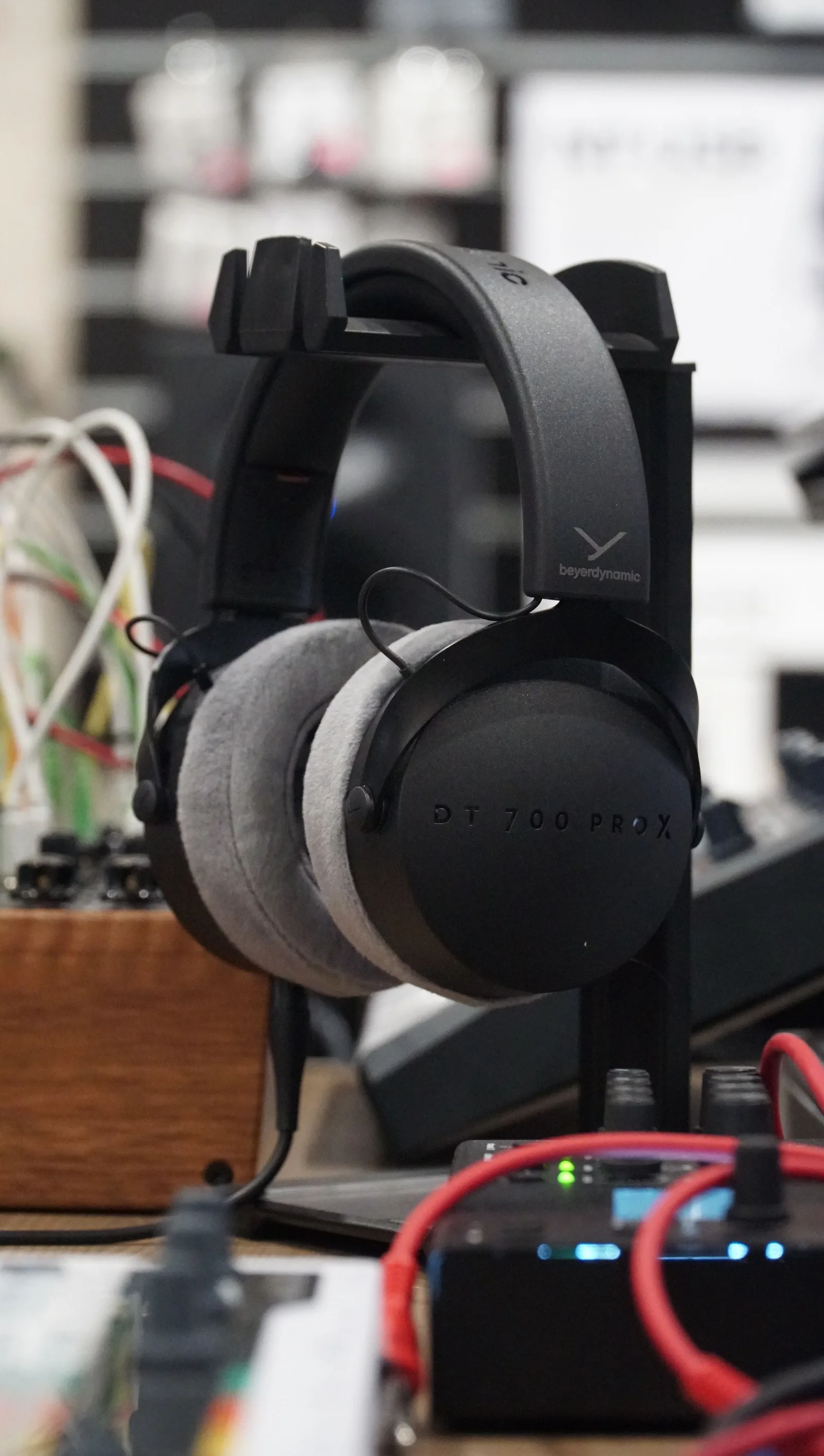 Source photo of black over-ear headphones, 2 of 3, taken on a phone